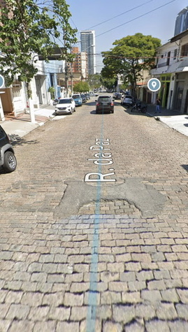 Exemplo de via local com tráfego de ônibus e necessidade de reasfaltamento
